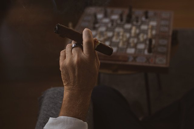 Cigar lounge with visible smoke requiring professional smoke smell removal